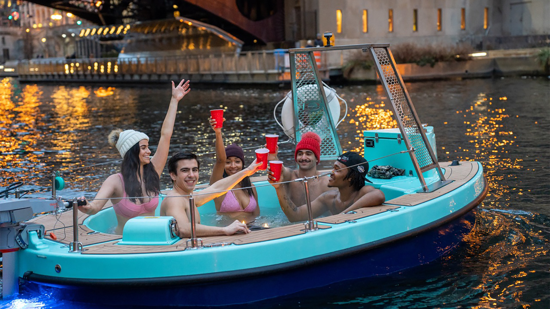 people in floating hot tub in the chicago river